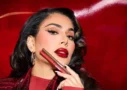 huda beauty lip contour stain Huda Kattan is promoting her new lip contour with red background and new trend makeup on her face