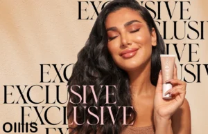 huda beauty GloWish Review a picture of Huda kattan that well known as HudaBeauty holding her new trend product on her handand smiling