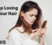 an image of a young women warring about losing her hair and looking at hair comb