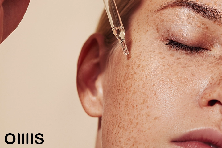 a woman using essential oils or skincare to renew her skin