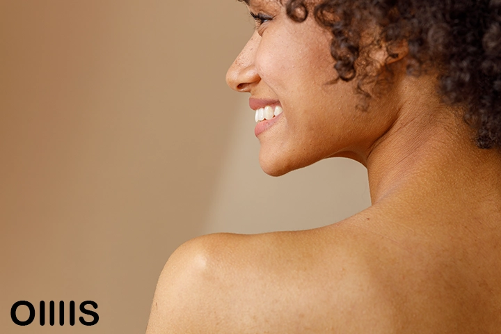 a curly hair half face on the picture young lady with nude body